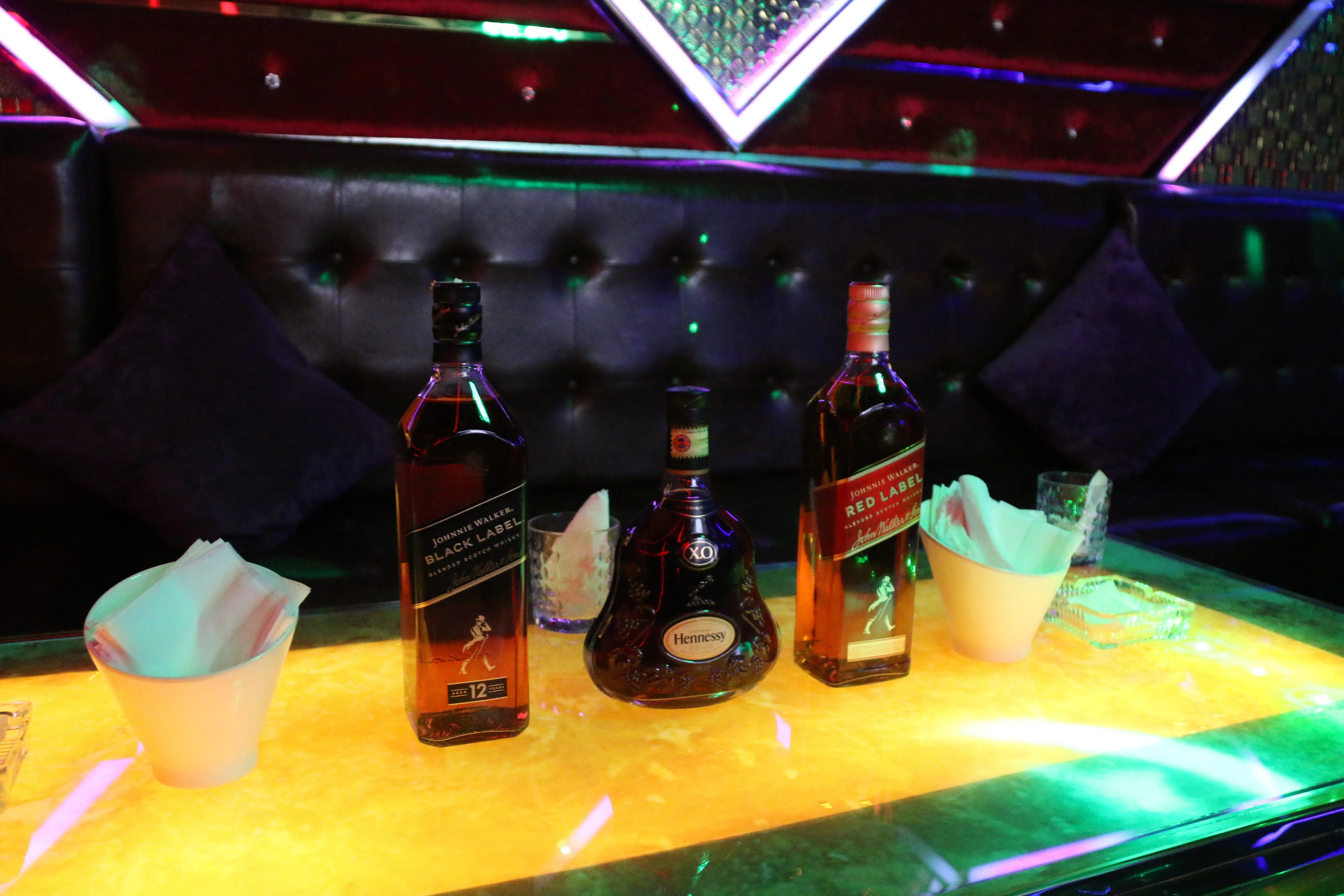 Premium whisky and cocktails in a dark luxury bar